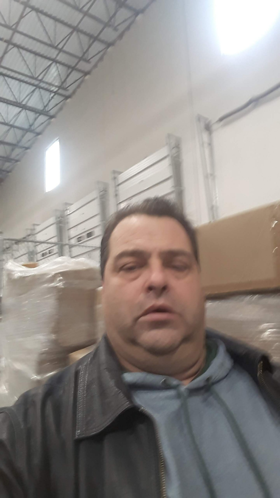 John Baldino in a warehouse