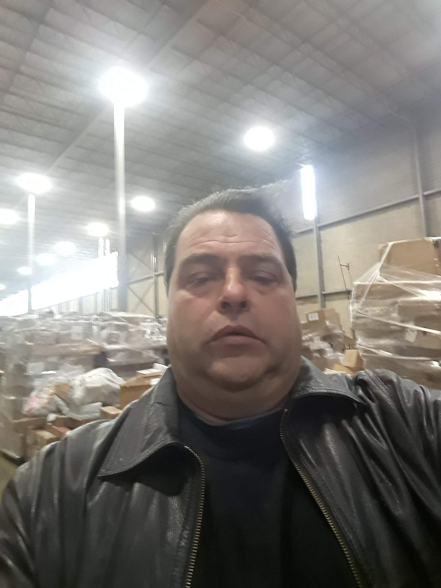 John Baldino among warehouse inventory
